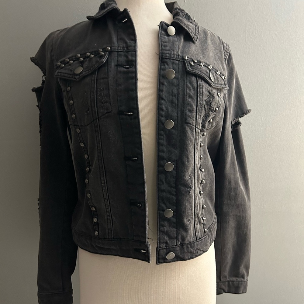 Black distressed and studded denim jacket